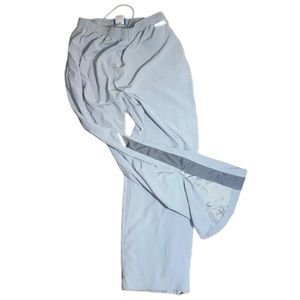 Striped Reebok sweatpants w zippers at bottom